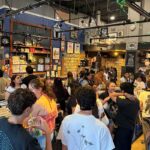 Crowd filling Armadillo Music in Davis during a listening party for Ariana Grande's Pedal