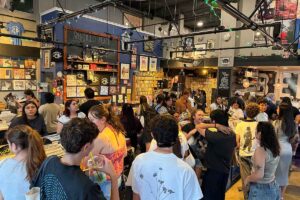 Crowd filling Armadillo Music in Davis during a listening party for Ariana Grande's Pedal