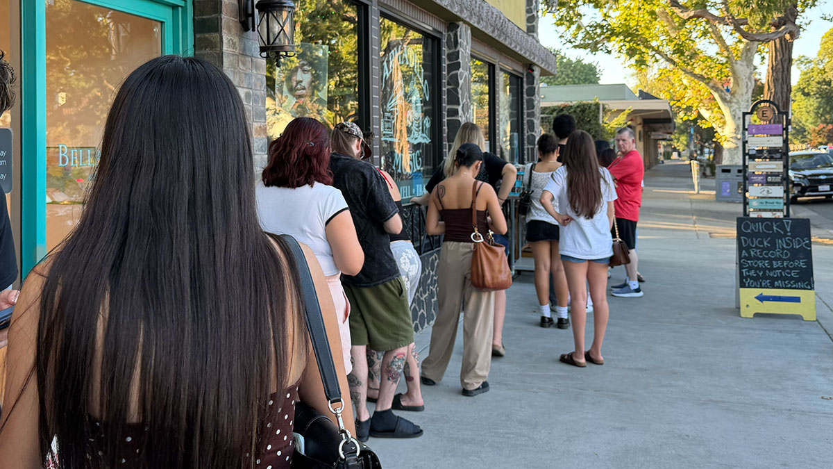 People lined up for a record release listening party at Armadillo Music in Davis
